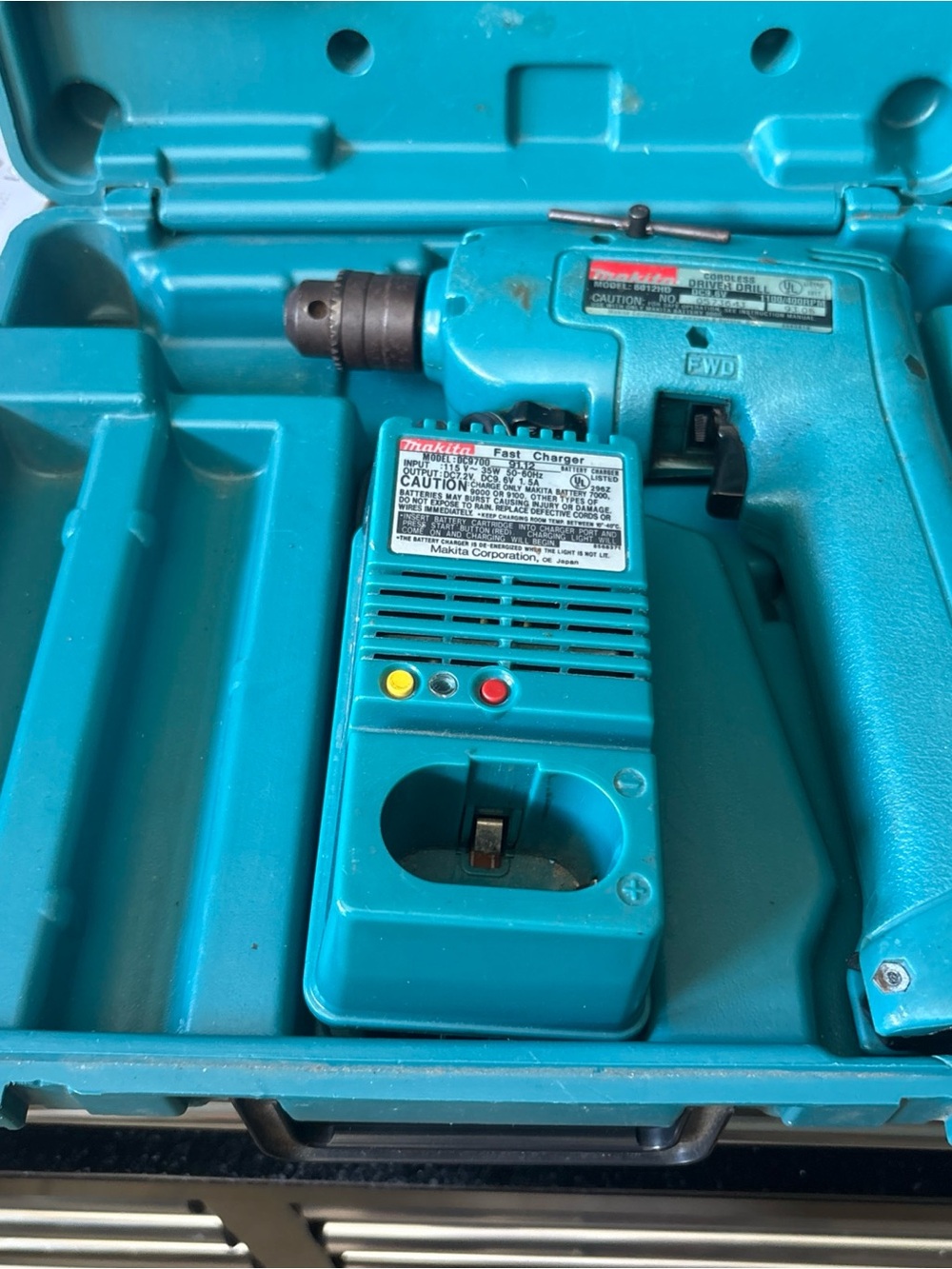 Makita Cordless Drill Model: 6012HD DC9.6V With Charger. Needs Battery